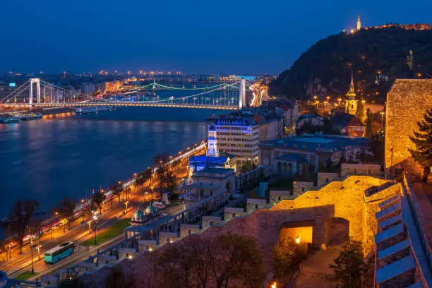Photo of Scenic view of Budapest city at blue hour with illuminated Buda Castle, Citadella on Hellert Hill and Danube embankment