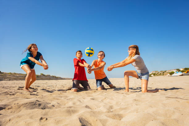 istock Happy beach volleyball players making forearm pass 1068404716