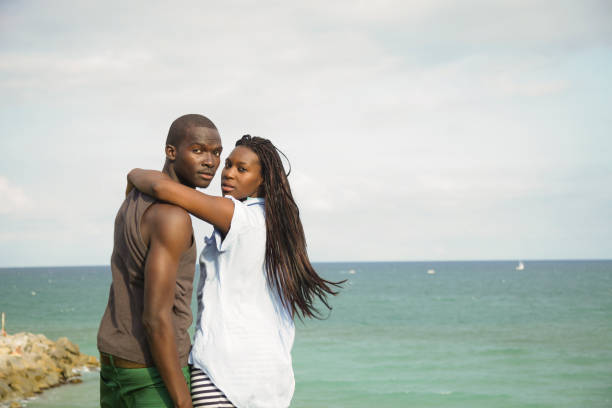 Romantic african couple front the sea