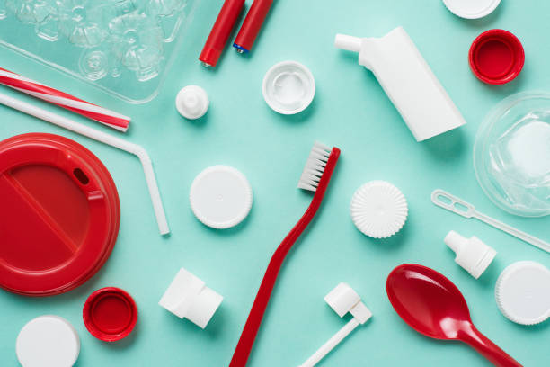 istock Top view of different kinds of disposable plastic garbage on blue background 1068412042
