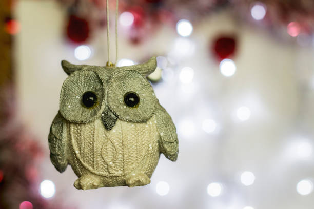 istock Christmas Holiday Background decorated with a silver owl decoration. 1068412710