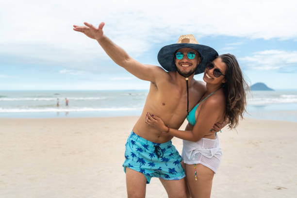 istock Couple Having Fun at Beach 1068413256