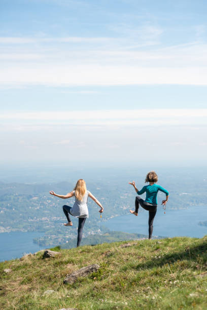istock Yoga exercises in nature on mountains: Shiva dance pose 1068416372