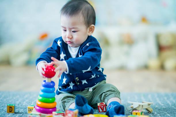 istock Adorable baby boy playing 1068418622