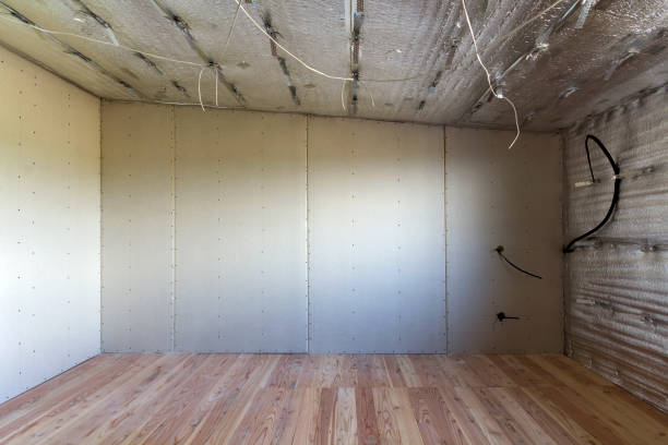 istock Room under construction with silver aluminum insulation foil and drywall on walls and ceiling. 1068419206