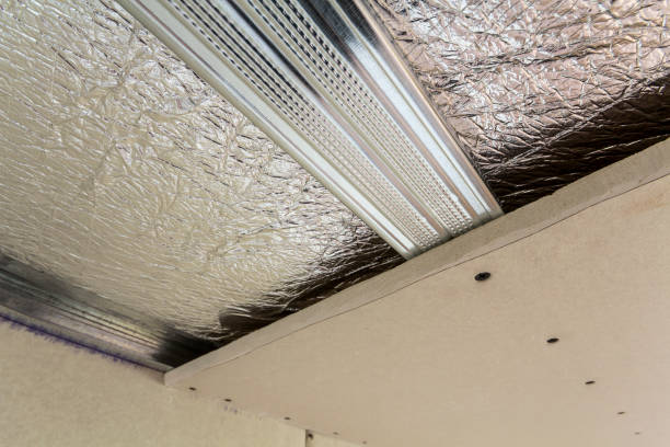 istock Room under construction with silver aluminum insulation foil and drywall on walls and ceiling. 1068419408