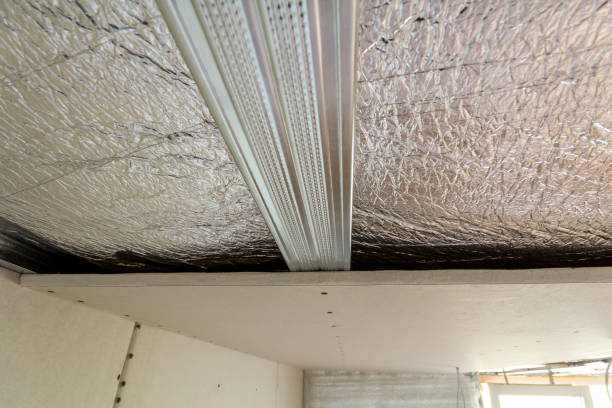istock Room under construction with silver aluminum insulation foil and drywall on walls and ceiling. 1068419420