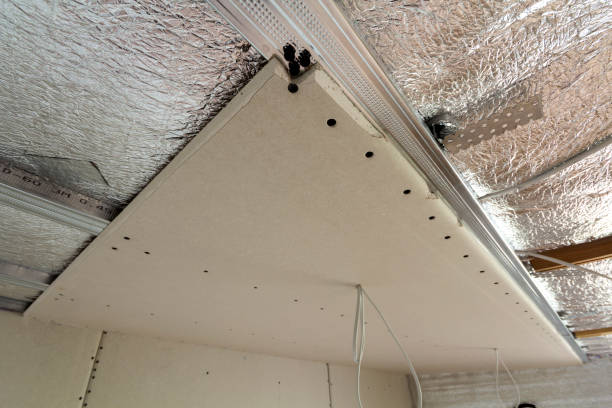 istock Room under construction with silver aluminum insulation foil and drywall on walls and ceiling. 1068419498