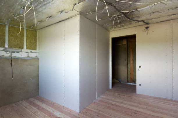 istock Room under construction with silver aluminum insulation foil and drywall on walls and ceiling. 1068419698