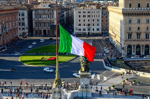 Italian national flag and Piazza Venezia. Vittoriano, Rome, Italy