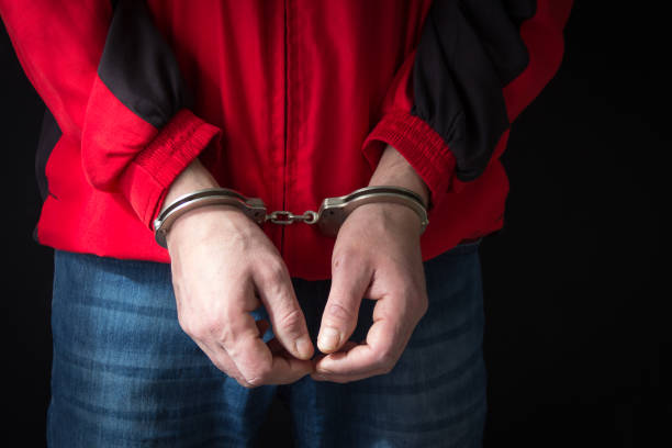 istock Criminal in handcuffs arrested for crimes 1068423062