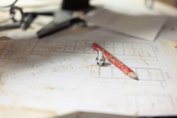 istock Red pencil and nut on the drawing 1068431312