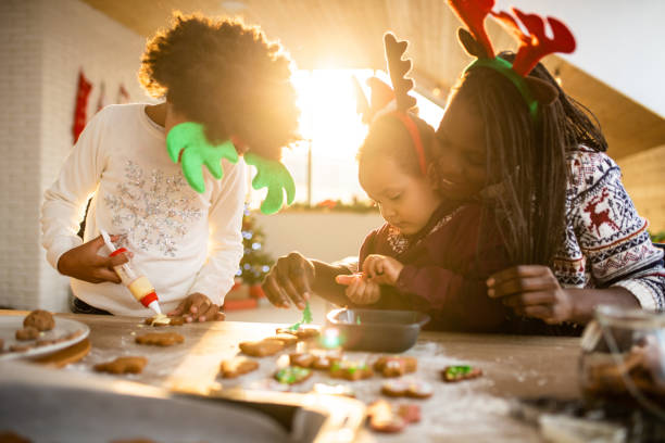 istock Family decorating Christmas cookies 1068433740