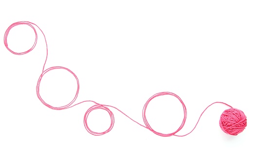 Circles of pink thread isolated on white background.