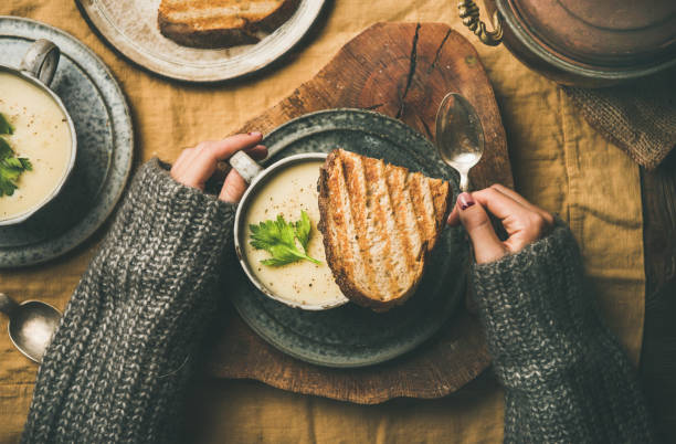 istock Autumn or winter dinner with celery cream soup in cups 1068436984