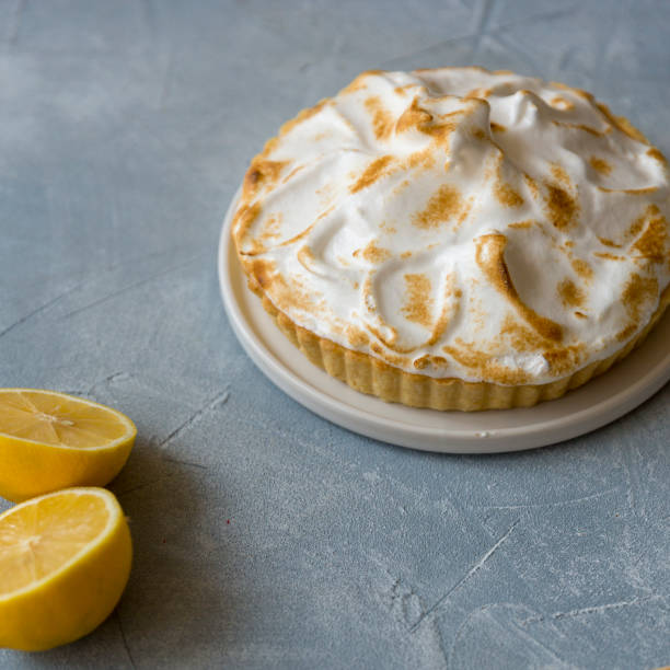 istock Tart with meringue and lemons at bray background 1068439256