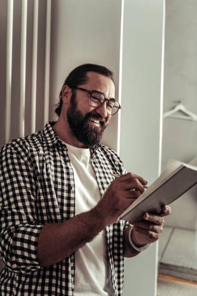 istock Cheerful good looking man planning his day 1068439672