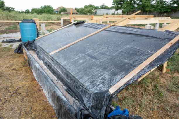 istock A box-platform for the impregnation of pine boards with an antiseptic protective agent against insects and fire. Construction of the frame house. 1068439998