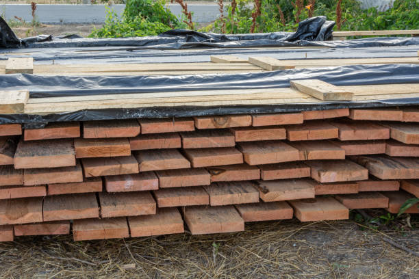 istock A stack of pine boards soaked in an antiseptic solution is dried at the construction site. Building materials for the construction of a frame house. 1068440098