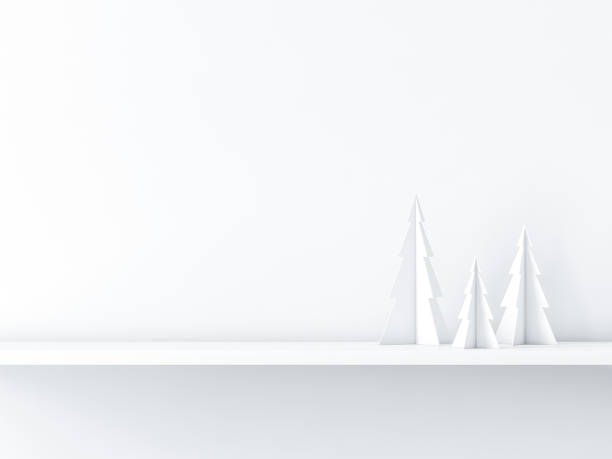 istock Three christmas trees on white shelf,  greeting card background 1068441922