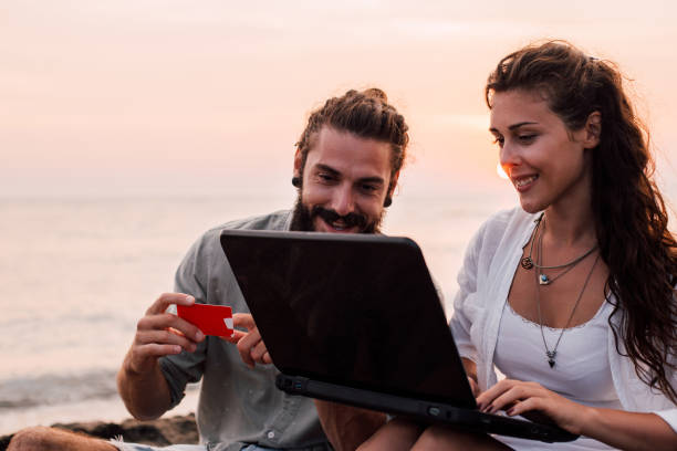 istock Smiling couple shopping online 1068442334