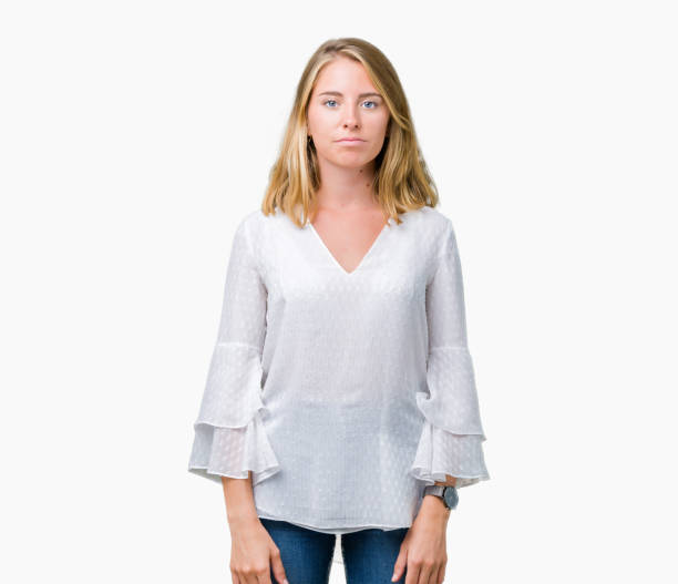 istock Beautiful young elegant woman over isolated background Relaxed with serious expression on face. Simple and natural looking at the camera. 1068442634