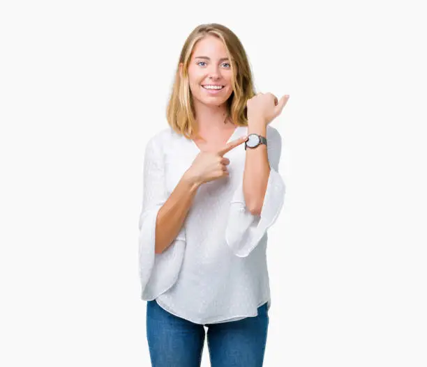 Photo of Beautiful young elegant woman over isolated background In hurry pointing to watch time, impatience, upset and angry for deadline delay