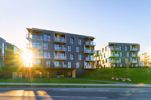 istock Modern apartment flat building real estate outdoor sunset 1068443344