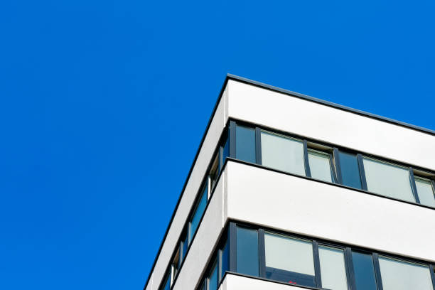 istock Modern corporate business office building skyscraper blue sky 1068443636