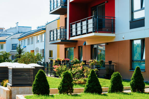 istock Modern residential apartment home flat building complex block outdoor 1068447688