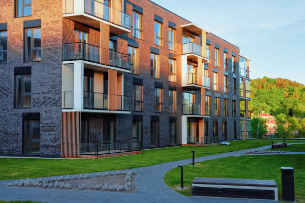 istock Modern residential apartment house building complex outdoor facilities 1068447736