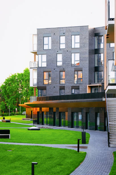 istock Modern residential apartment house building complex with outdoor facilities 1068447764