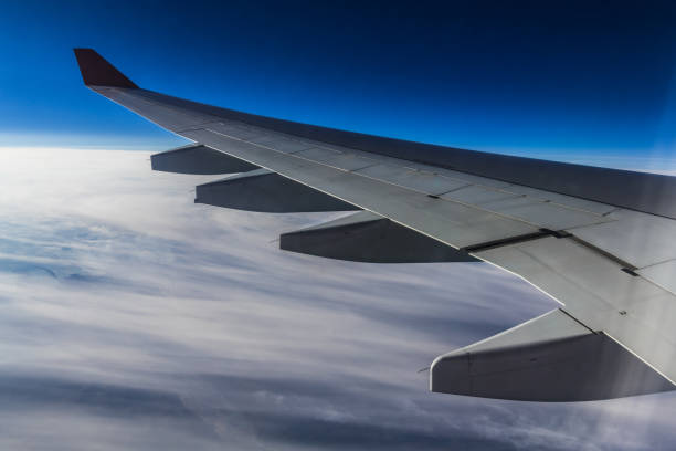 istock Clouds under the wing of the aircraft 1068449170
