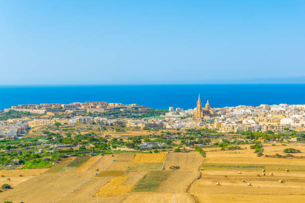 Aerial view of Mgarr on Gozo, Malta Aerial view of Mgarr on Gozo, Malta mgarr malta island gozo cityscape with harbor stock pictures, royalty-free photos & images
