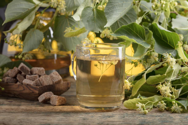 istock Glass of linden tea with brown sugar . 1068461202