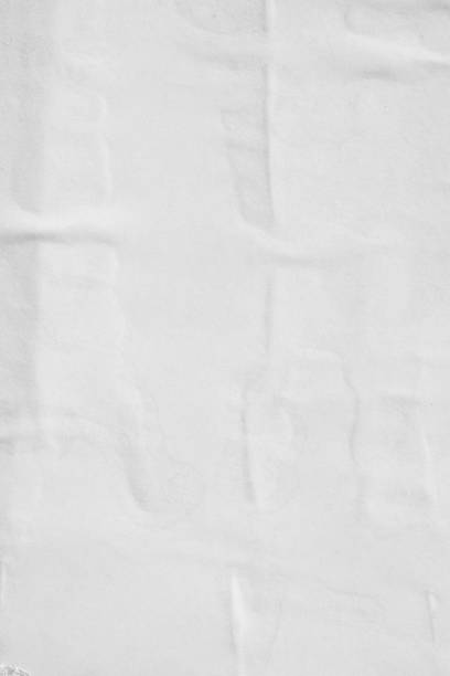 istock Blank white old ripped torn paper crumpled creased posters grunge textures backdrop backgrounds surface placard 1068469820