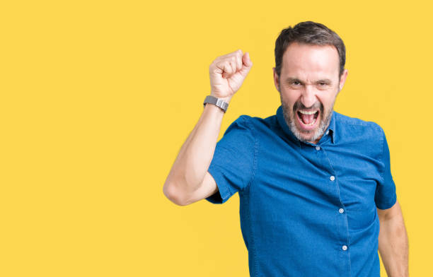 istock Handsome middle age elegant senior man over isolated background Dancing happy and cheerful, smiling moving casual and confident listening to music 1068470500