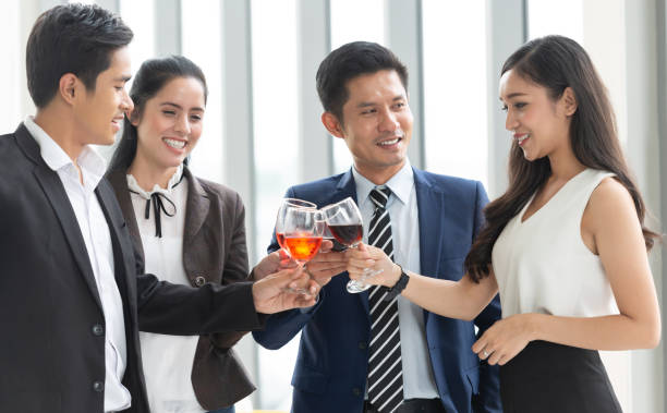 istock Group of Business People Toasting with red wine. 1068472978