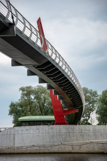 istock wooden and composite material foot bridge over water 1068477386