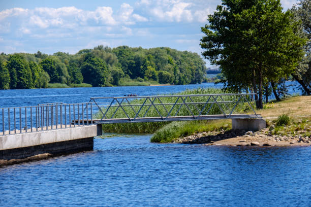 istock wooden and composite material foot bridge over water 1068477682