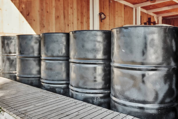 istock Black metal oil barrels 1068479148