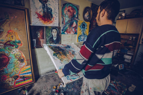 istock Man thinking about the painting 1068479964