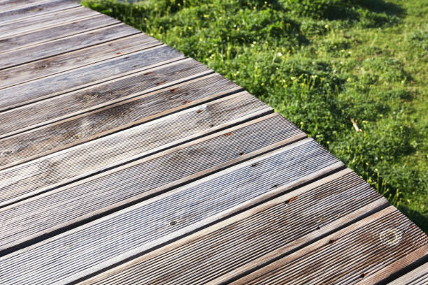 istock brown wooden planks of a curved platform 1068481508