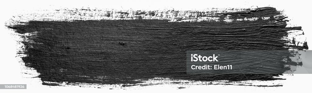 Long rectangular hand drawn isolated paintbrush stripe with dirty black color ink. Splatter Paint Texture. Distress rough background. Scratch, Grain, Noise rectangle stamp. Copy space for your text. Brush Stroke Stock Photo