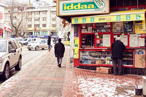 Scenes from everyday street life in Turkey. A man is filling an Iddaa coupon for betting on some sports games. So far, Iddaa has allowed players to choose from 183 foreign league and cup matches.