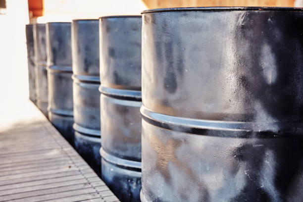 istock Black metal oil barrels 1068486966