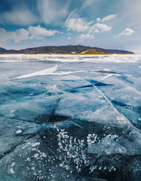 istock Frozen lake Baikal, Siberian winter 1068487088