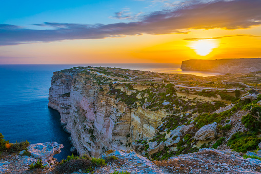 Sunset view over Ta Cenc cliffs on Gozo, Malta