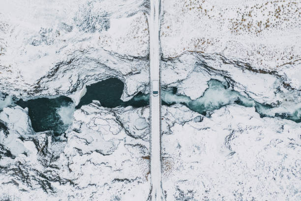 malerische luftaufnahme der koluglufur wasserfall im winter - brücke fotos stock-fotos und bilder