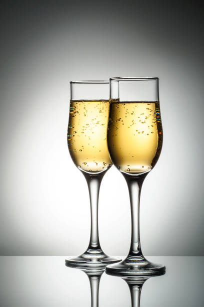 istock Two elegant glasses with sparkling champagne 1068512806